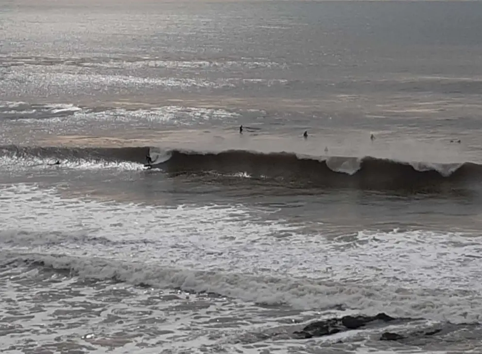 Catching a ride at St Ann's surf break.
