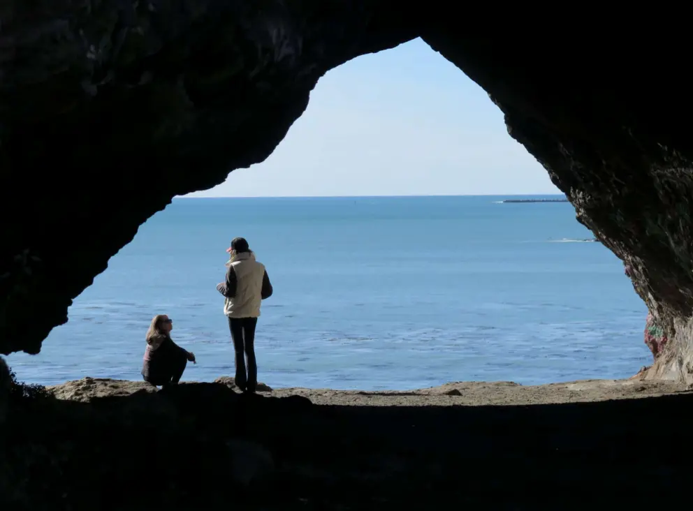 Women talking in the cave.