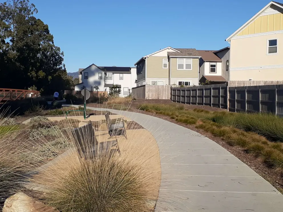 A yellow house by the path.