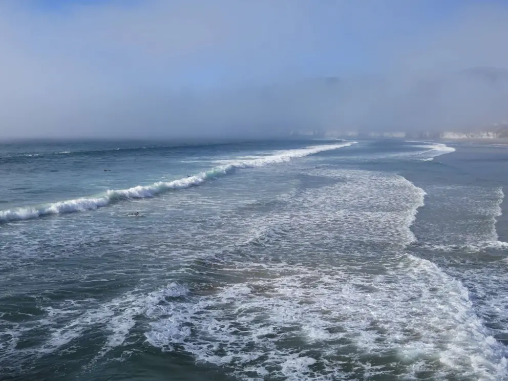 California doesn't get cool thunderstorms like Florida, but it does get the fog rolling in! Half the beach is sunny and half is foggy!