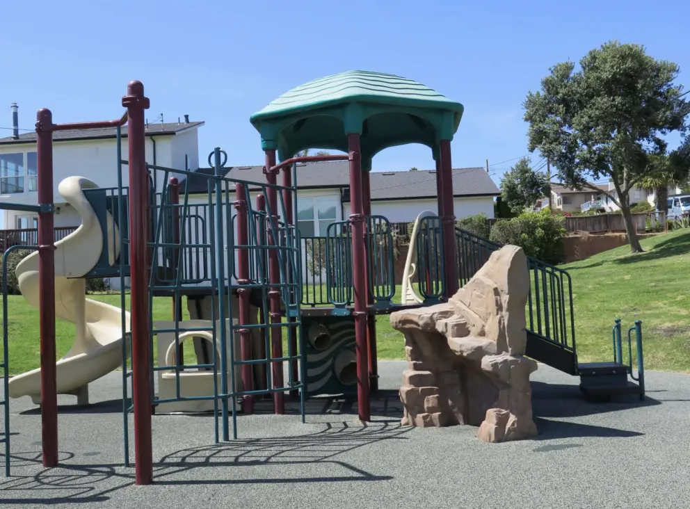 Rock to climb and other climbies, plus twisty slide.