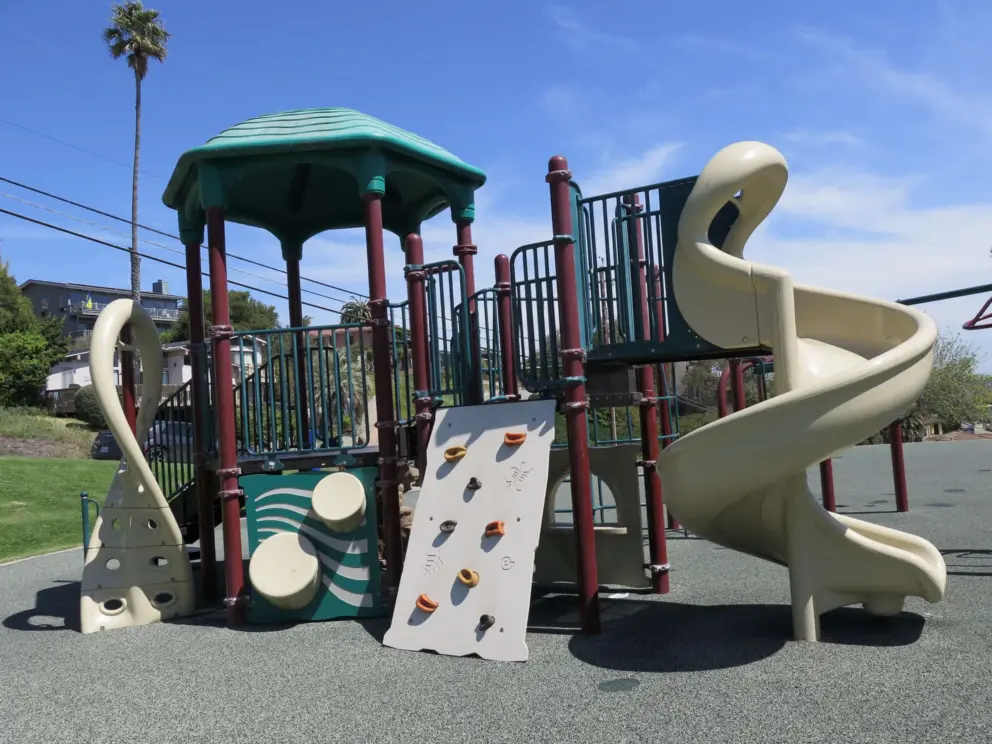 Twisty slide, rock climbing mini-wall, drums. 