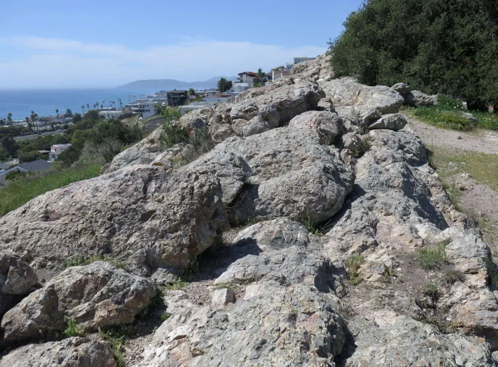 The rocks to sit on. 