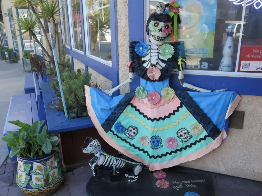 Day of the Dead scarecrow outside a restaurant.