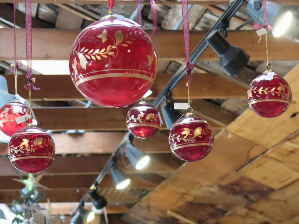 Huge red and gold glass spheres hanging from the ceiling. 