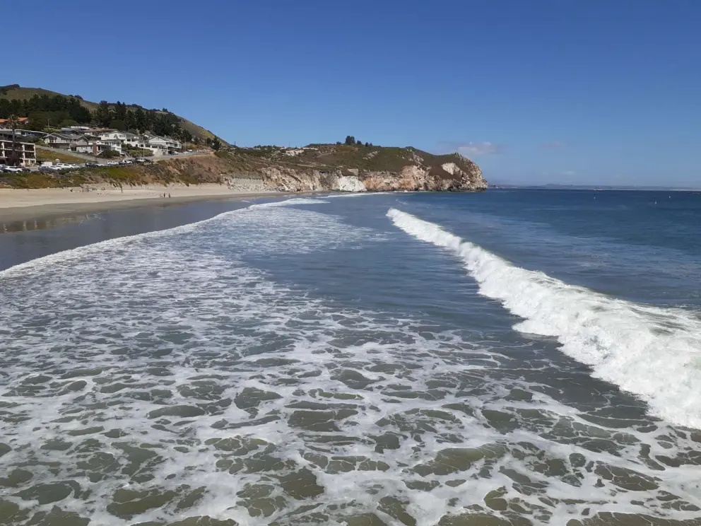 View from the pier, of frothy waves. 
