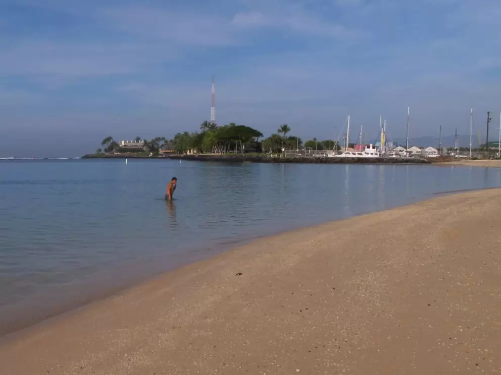 A man leaves the water after an early morning swim.