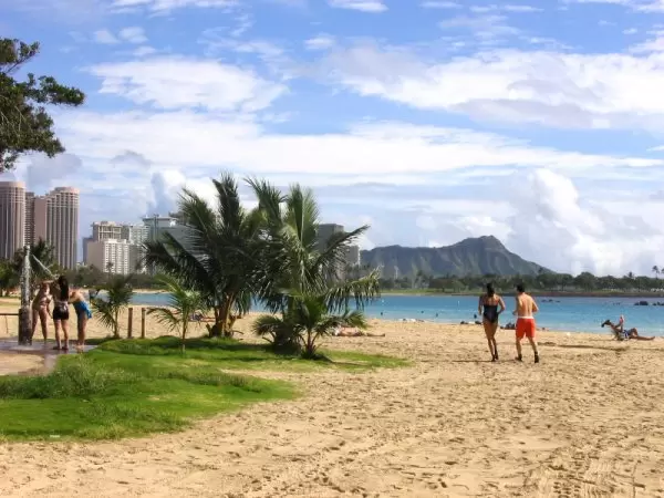 Joggers on Ala Moana Beach.