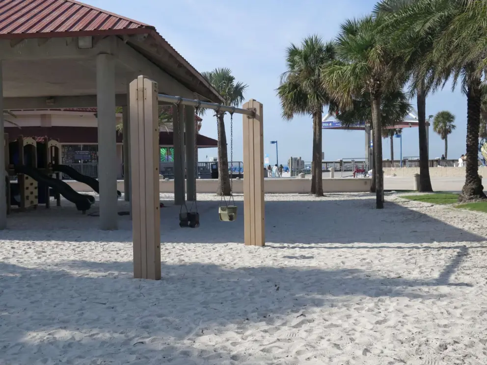Baby swings facing the ocean.