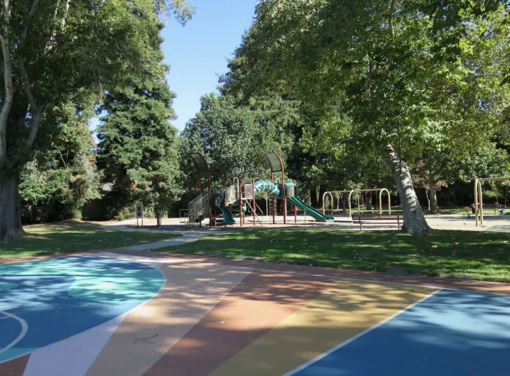 The beautiful painted basketball court, and playground in the distance. 