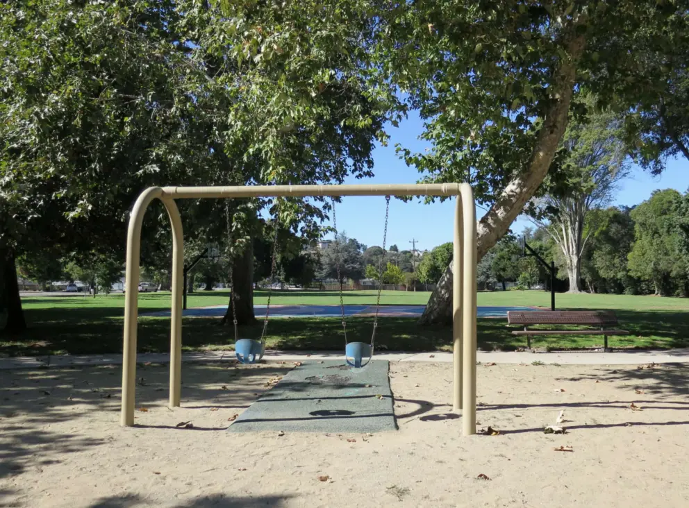Baby swings and bench for parents. 