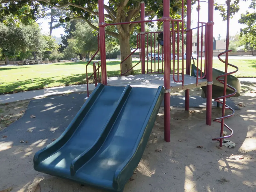 Double slide and spiral climbey at the toddler playground. 