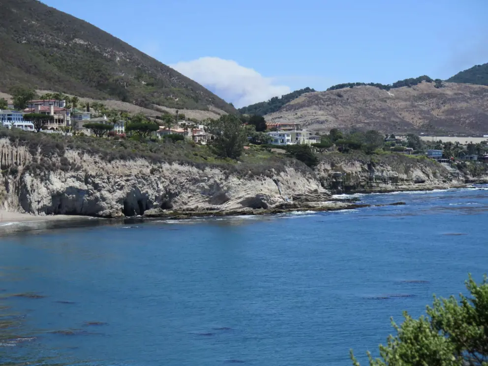 Looking down at the end of Pirate's Cove Beach and the mansions on Bluff Drive. 