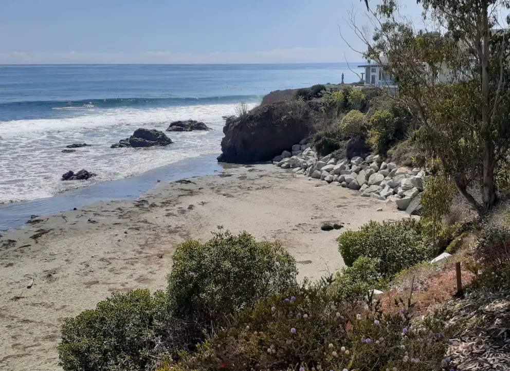 View of the curve of beach at the north end of Cayucos Beach. 