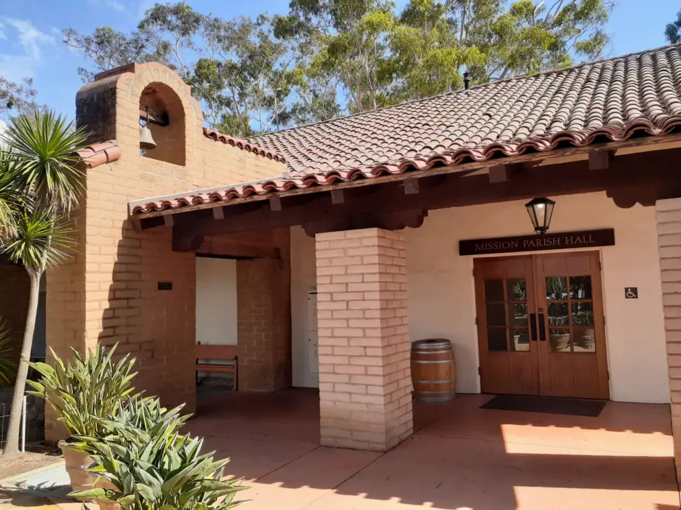 The parish hall with its brick architecture and Spanish roof. 