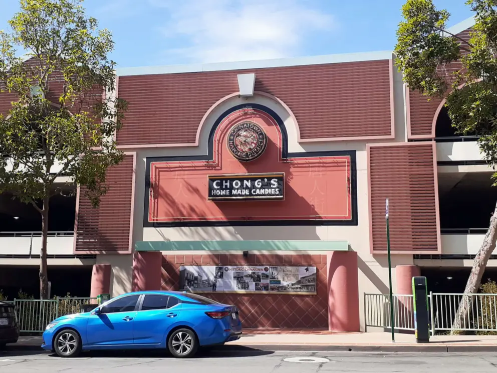 One block uphill from the mission, Chinese and Filipino people had businesses from 1860-1980. On the parking lot is a neon sign from Chong's Home Made Candies. 