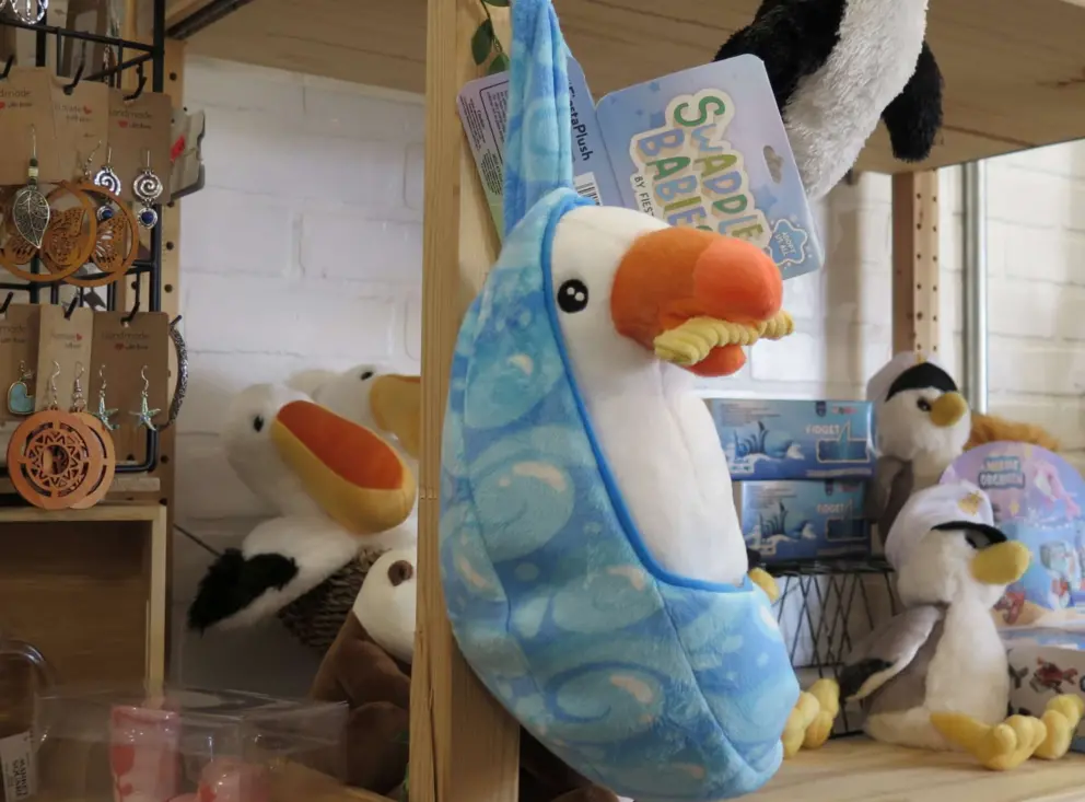 Baby seagull stuffie with a fry! At Port San Luis Boatyard (repair shop), a bit of a musty spot. 