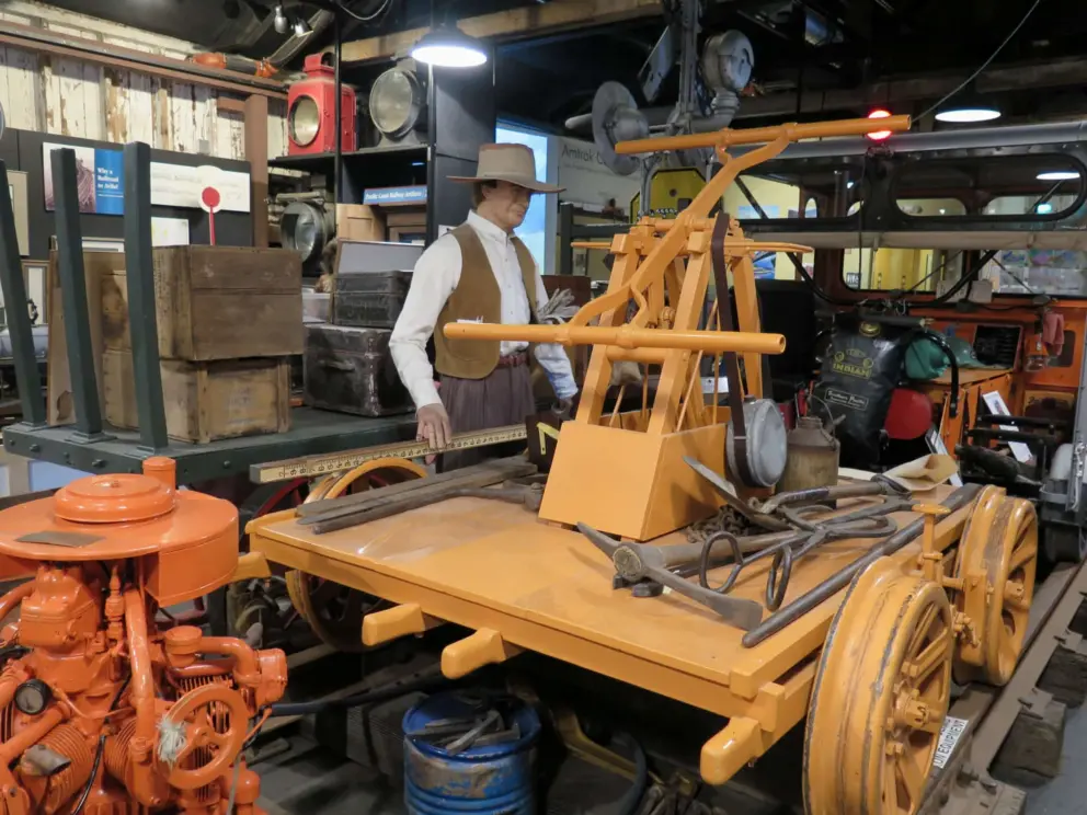 Life-size mannequin of a miner operating a handcar, on display inside the San Luis Obispo Railroad Museum. 