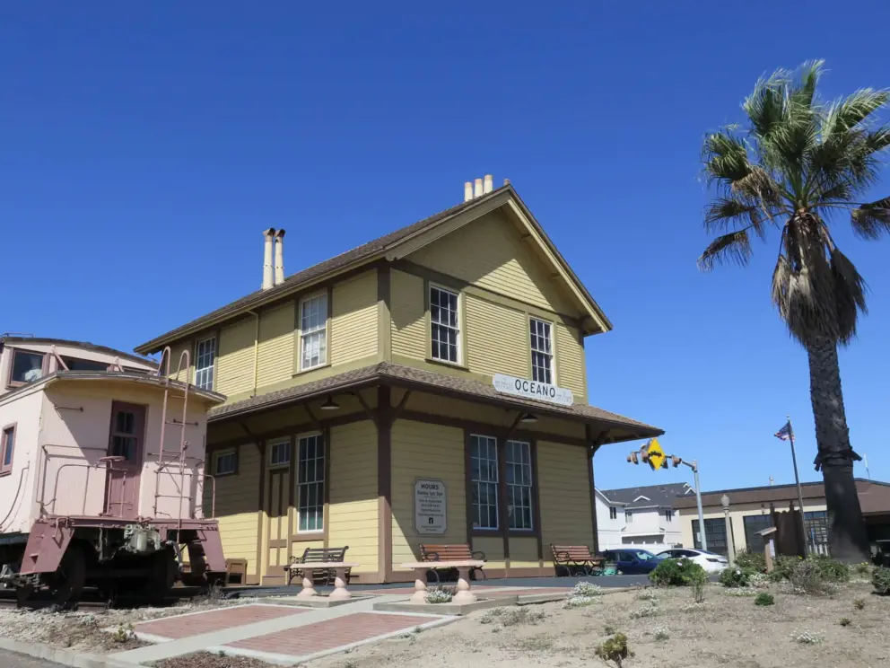 California palm, the yellow depot building, and the caboose. 