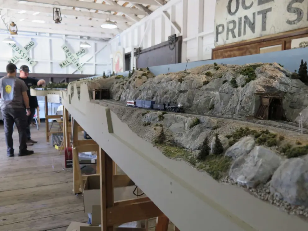 Model railroad enthusiasts setting up their train, during October open day. 