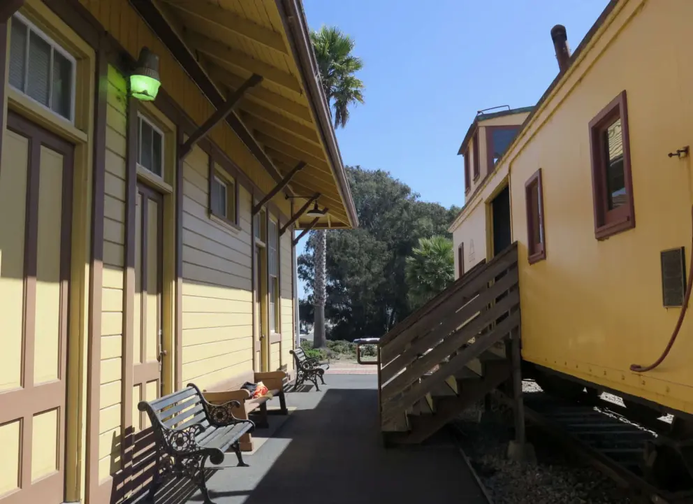 Caboose and the yellow depot building. Beautiful!