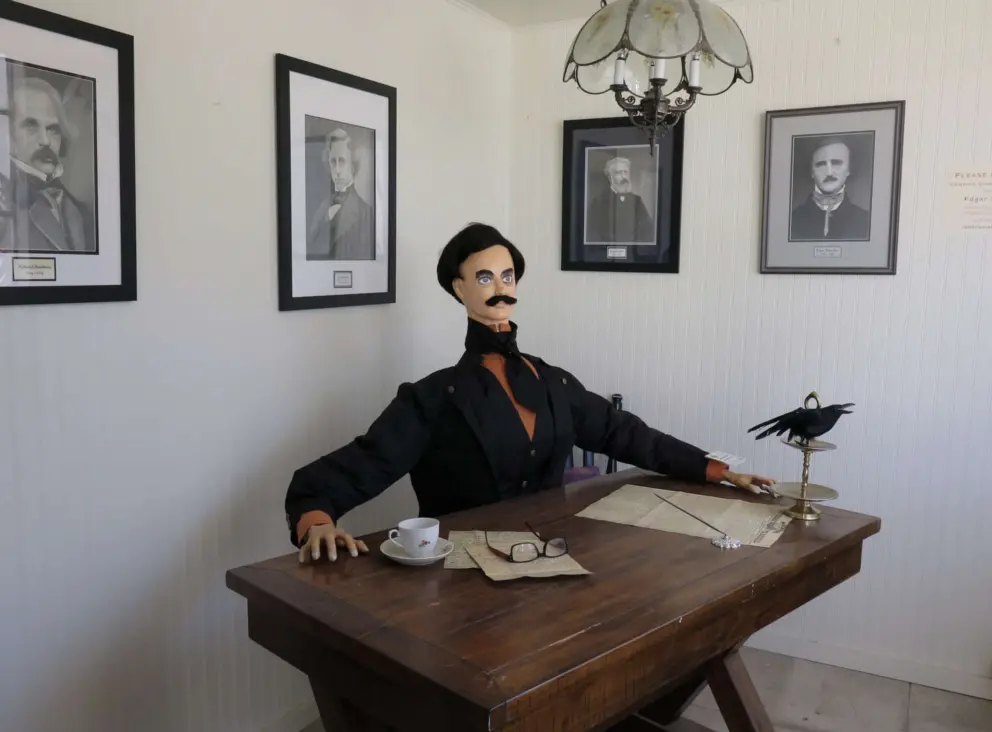 Edgar Allan Poe scarecrow in the Harmony historic post office, in October during the Cambria Scarecrow Festival. 