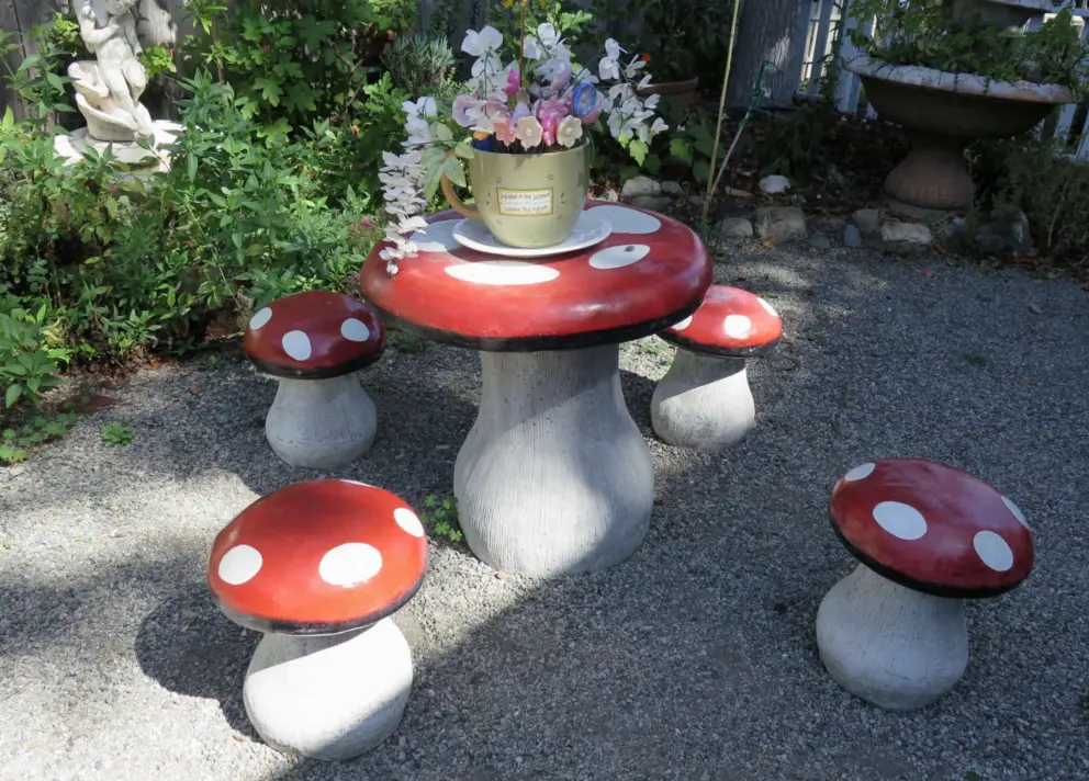 Toadstool mushrooms table and stools in the garden at Spellbound Gifts. 