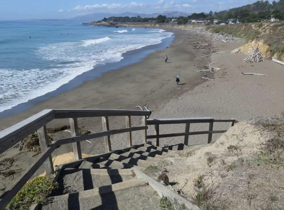 Stairs down to the sand, where you will find driftwood teepees!