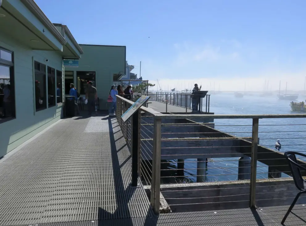 Fog in the distance but sun on the walkway.