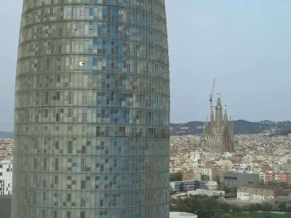 Glories Tower, with Sagrada Familia in the distance, from the rooftop bar of Novotel Barcelona City Hotel. 