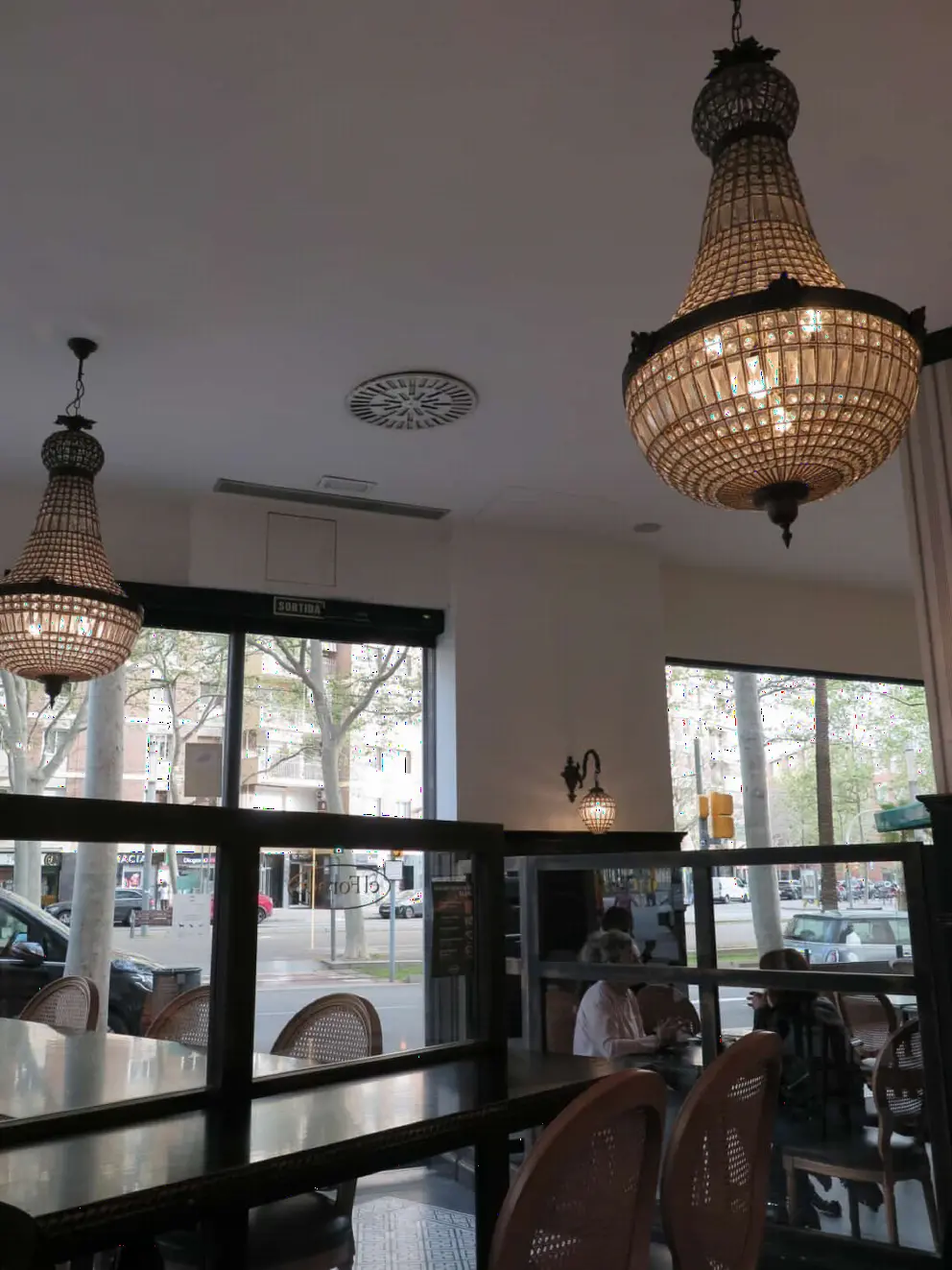Fancy chandeliers inside El Fornet Bakery. 