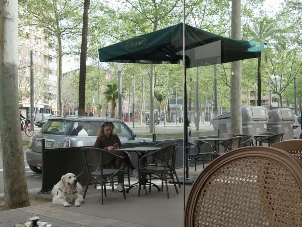 Sitting outside El Fornet Bakery under their square umbrella. 