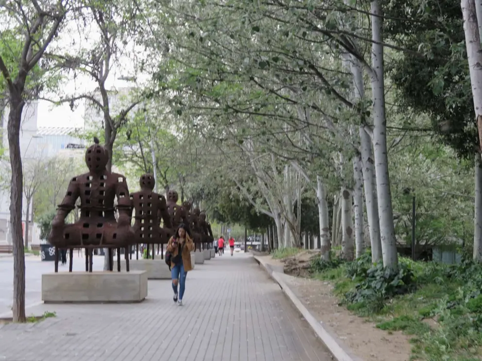 Statues along a walkway in the El Poblenou neighborhood. 