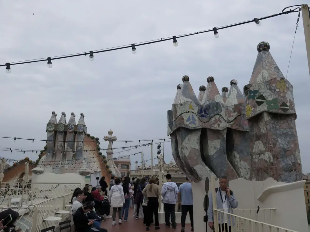 Sloping tiled chimneys on the rooftop. 