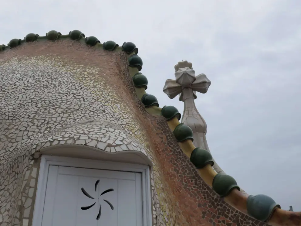 Rooftop, like the scales on a dragon's back, and bulbous cross, like Saint George's lance. 