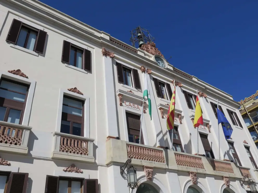 The town hall with its ironwork bell atop.