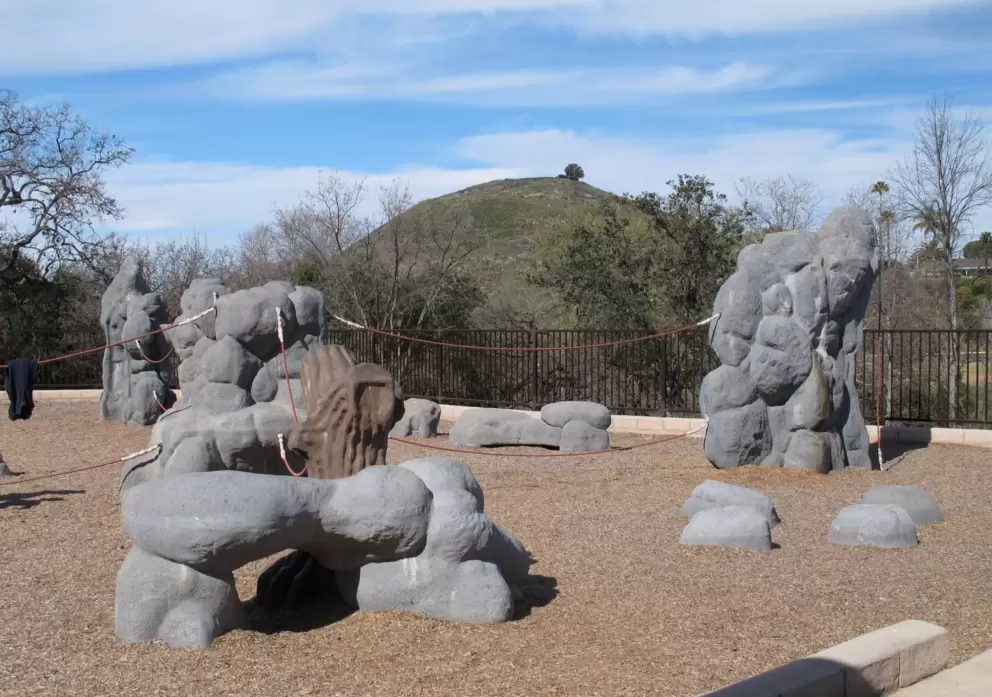The new playground is awesome! And see the view of the pretty hill behind.