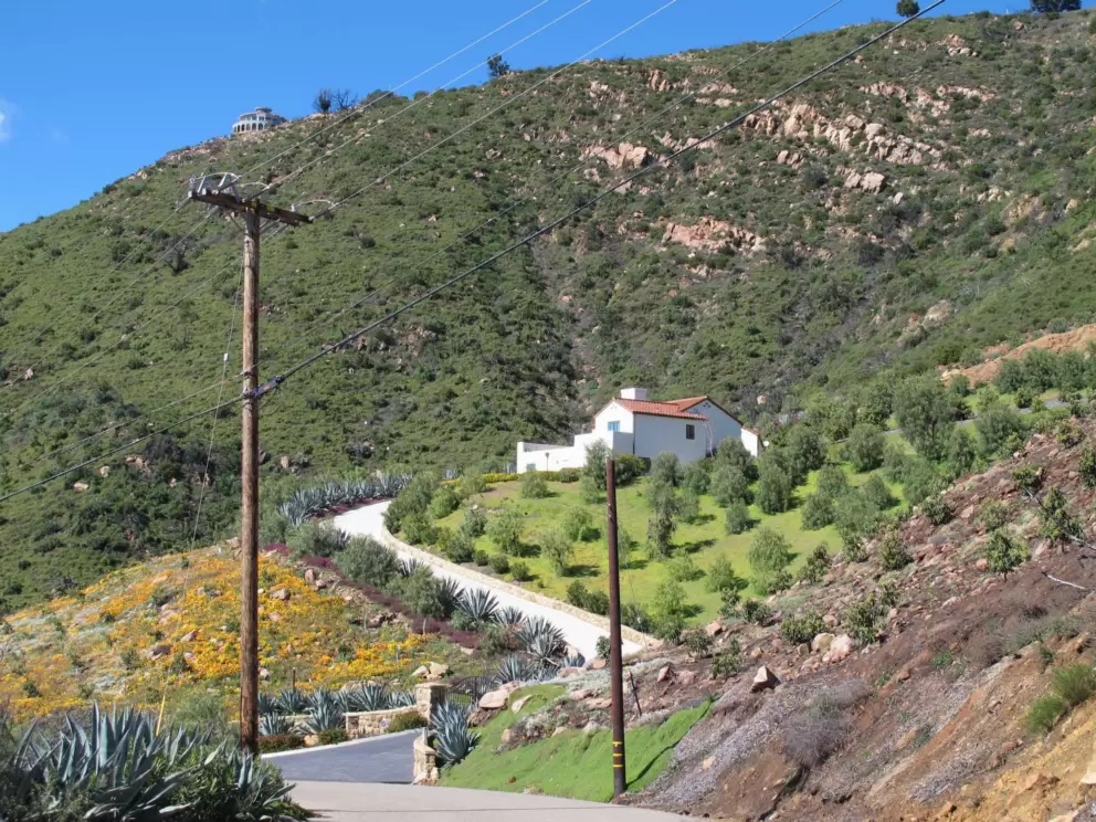 Cute house with flower-covered hill on Gibraltar Road.