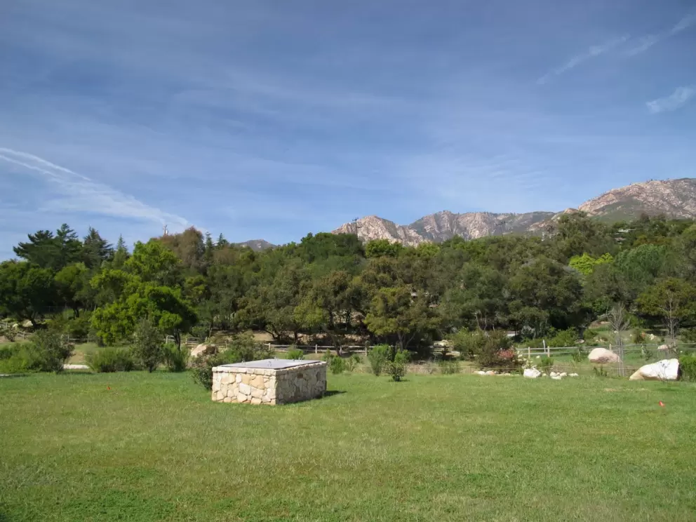 Wide green spaces and mountains.