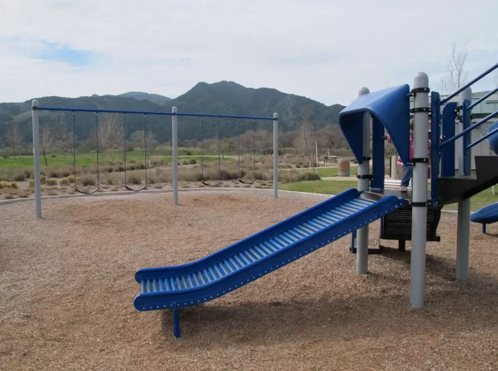 Kids LOVE roller slides! Swings with mountain views.
