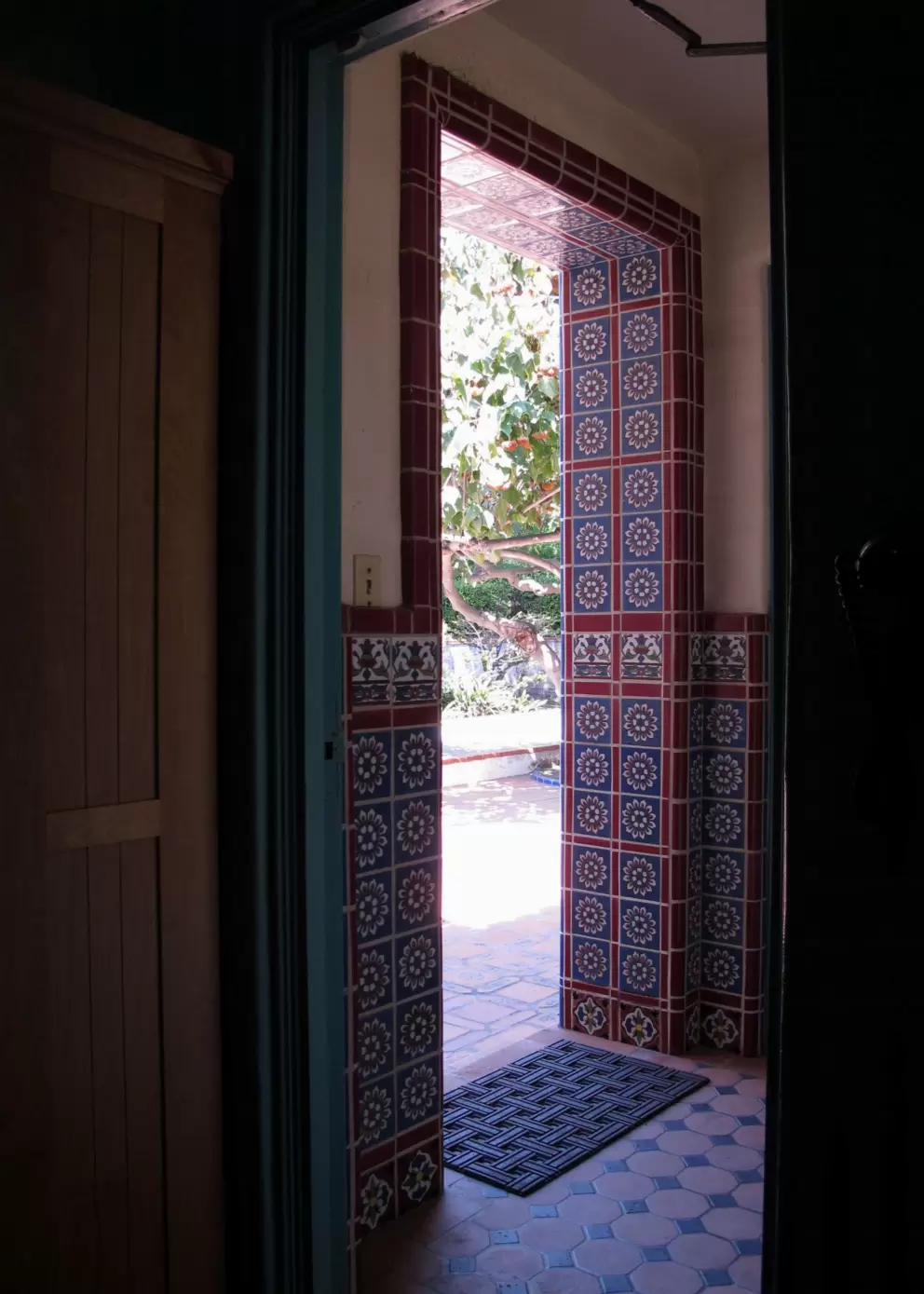 Tiled door leading to the back courtyard.