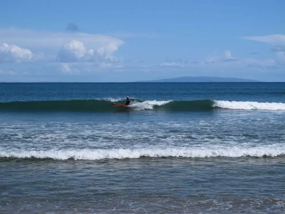 Riding the waves at famous Malibu Surfrider Beach.
