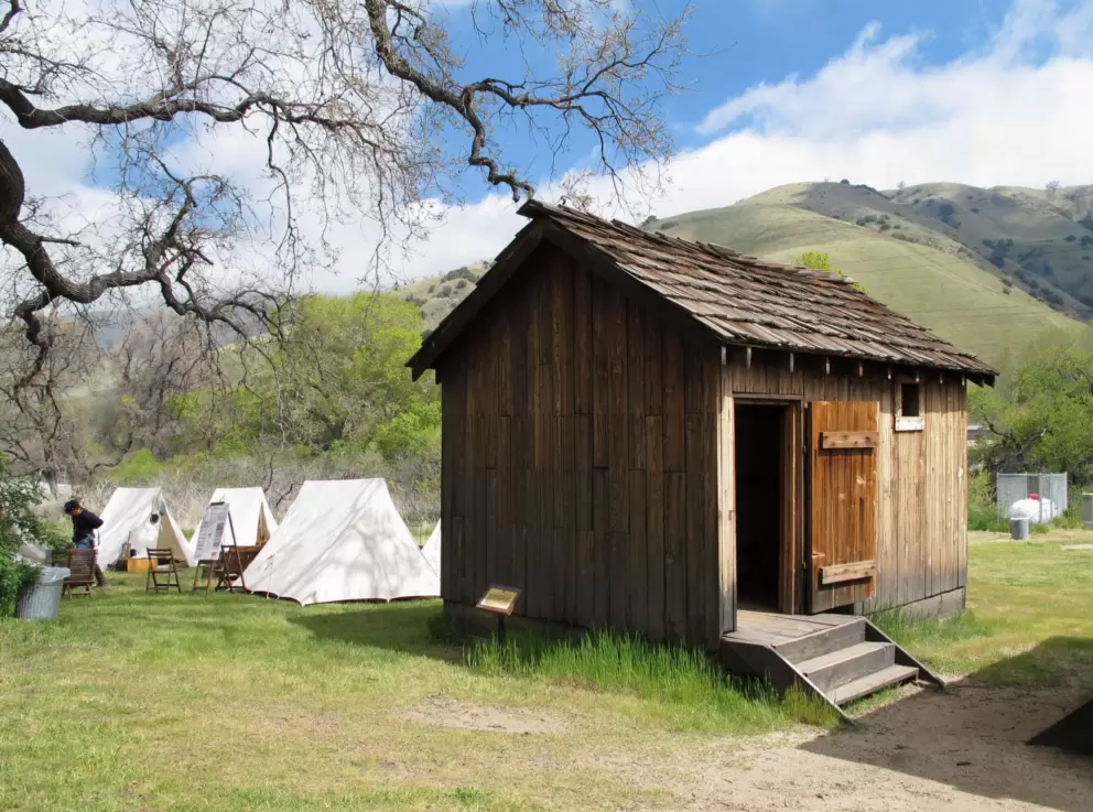 Shed and tents, set up like civil war days.