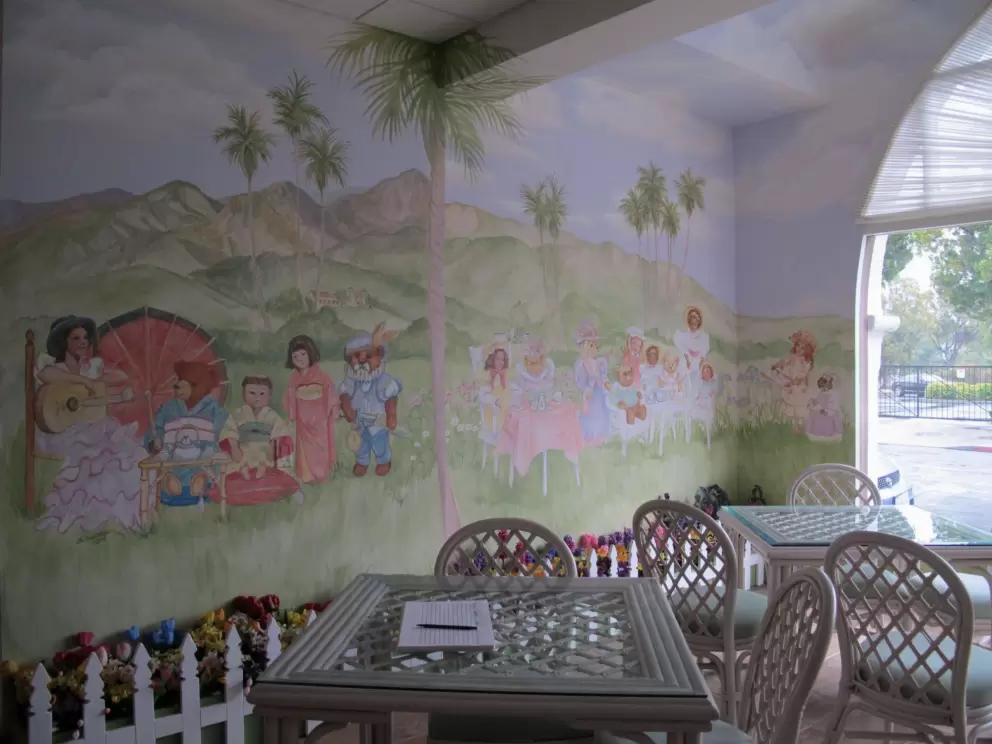 Tea room with mural of teddy bear picnic with Santa Ynez mountains behind.