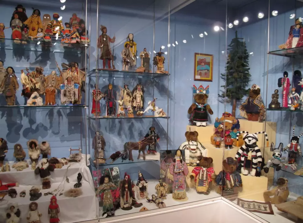 Display case with Native American dolls.