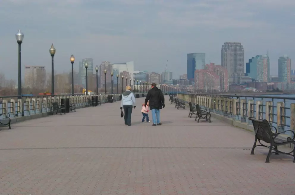 Taking a winter stroll along the boardwalk with views of Jersey city skyline.