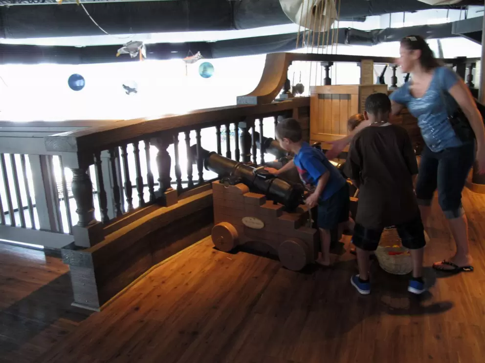 Shoot the cannons from the top level!