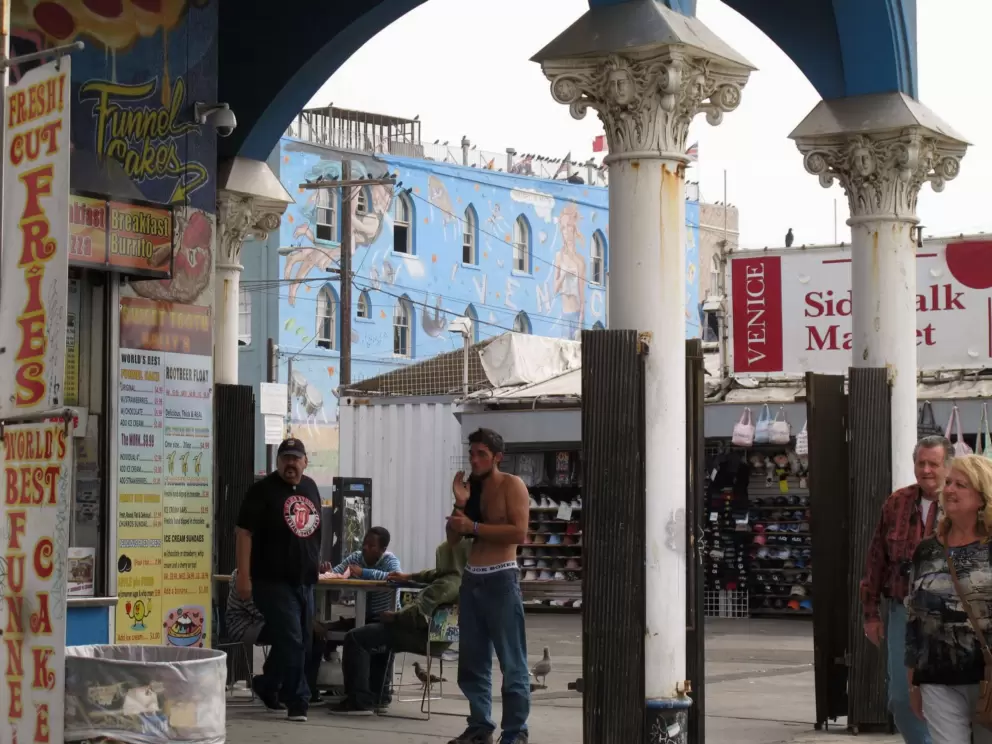 Reading the menu at a grotty eatery- check out the architecture.