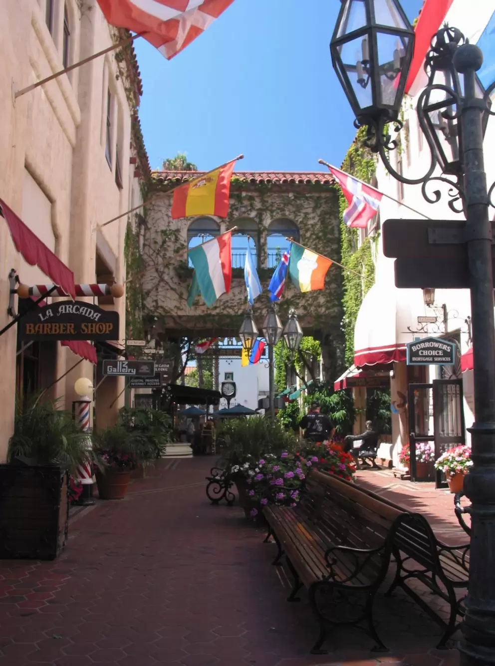 The alley that leads to State Street, where you will find the Ben Franklin Statue, Mozart Trio Statue, and bronze dolphins.