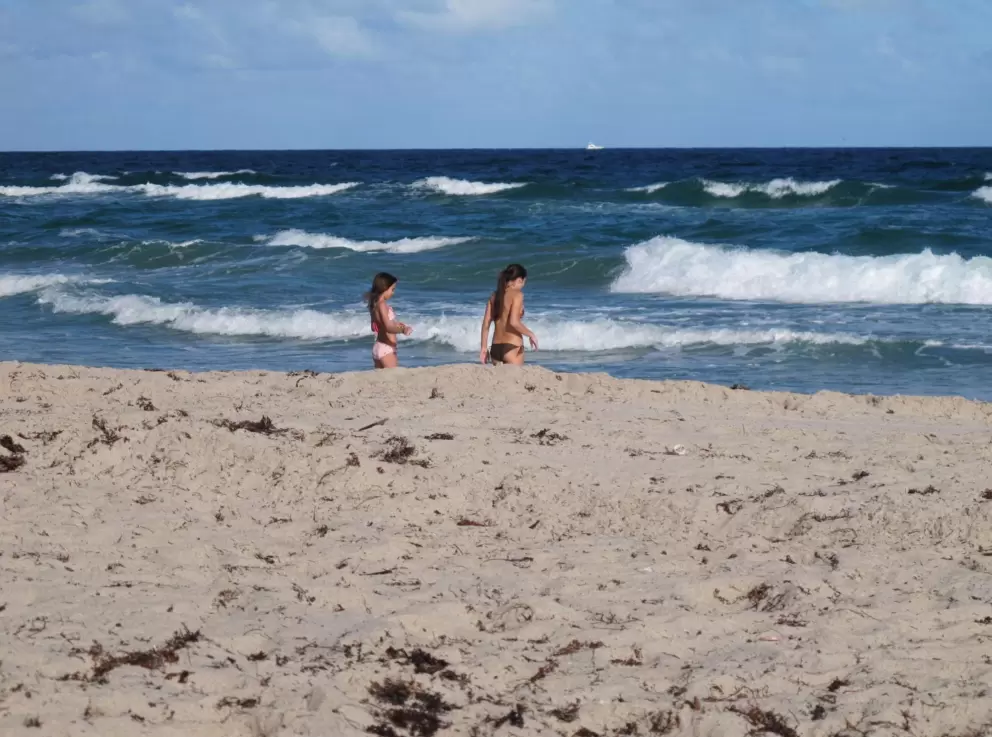 Girls at the shoreline.